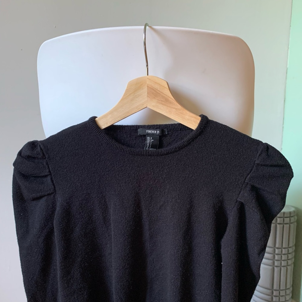Black sweater with slightly puffy sleeves